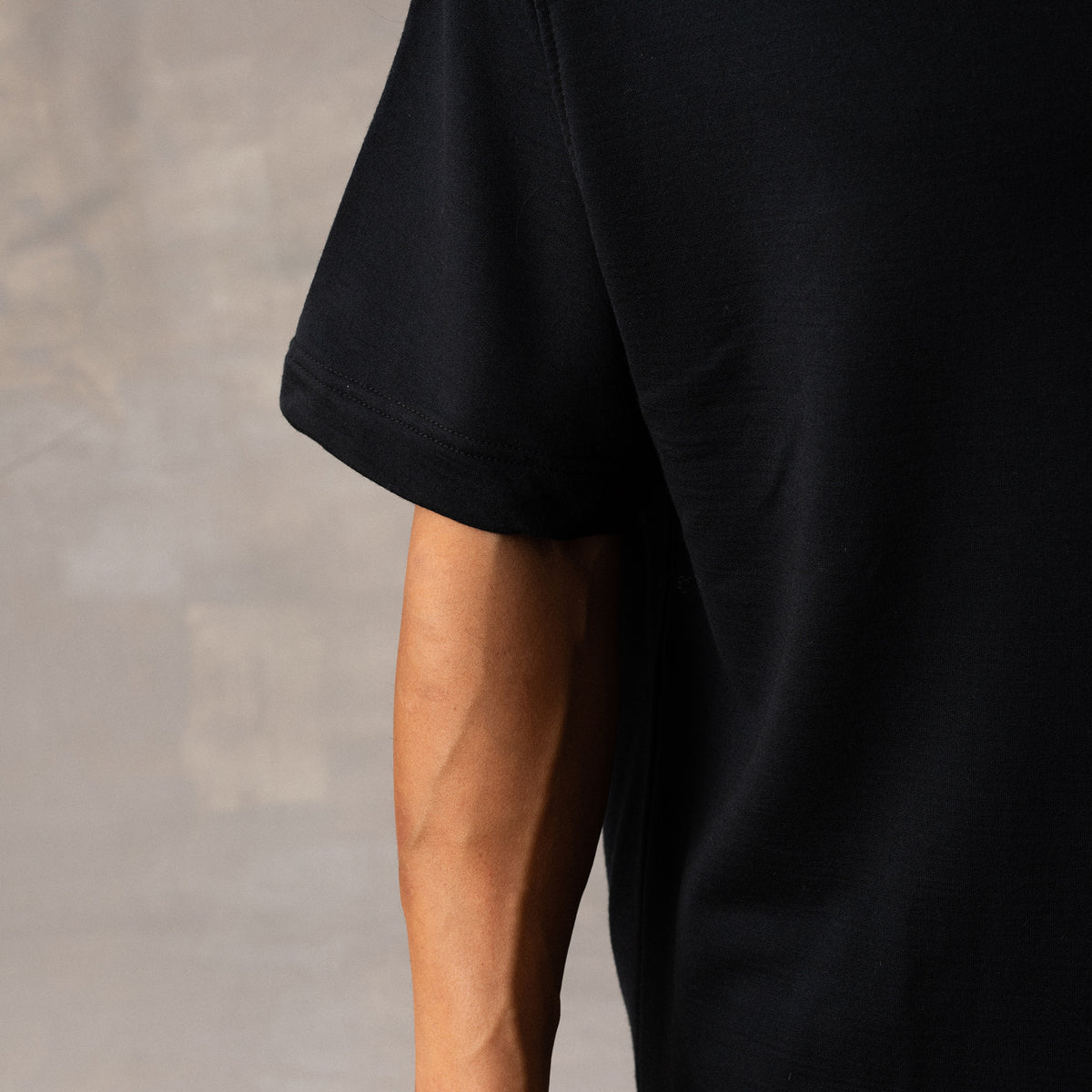 The Box Tee in black heavy merino wool, detail view