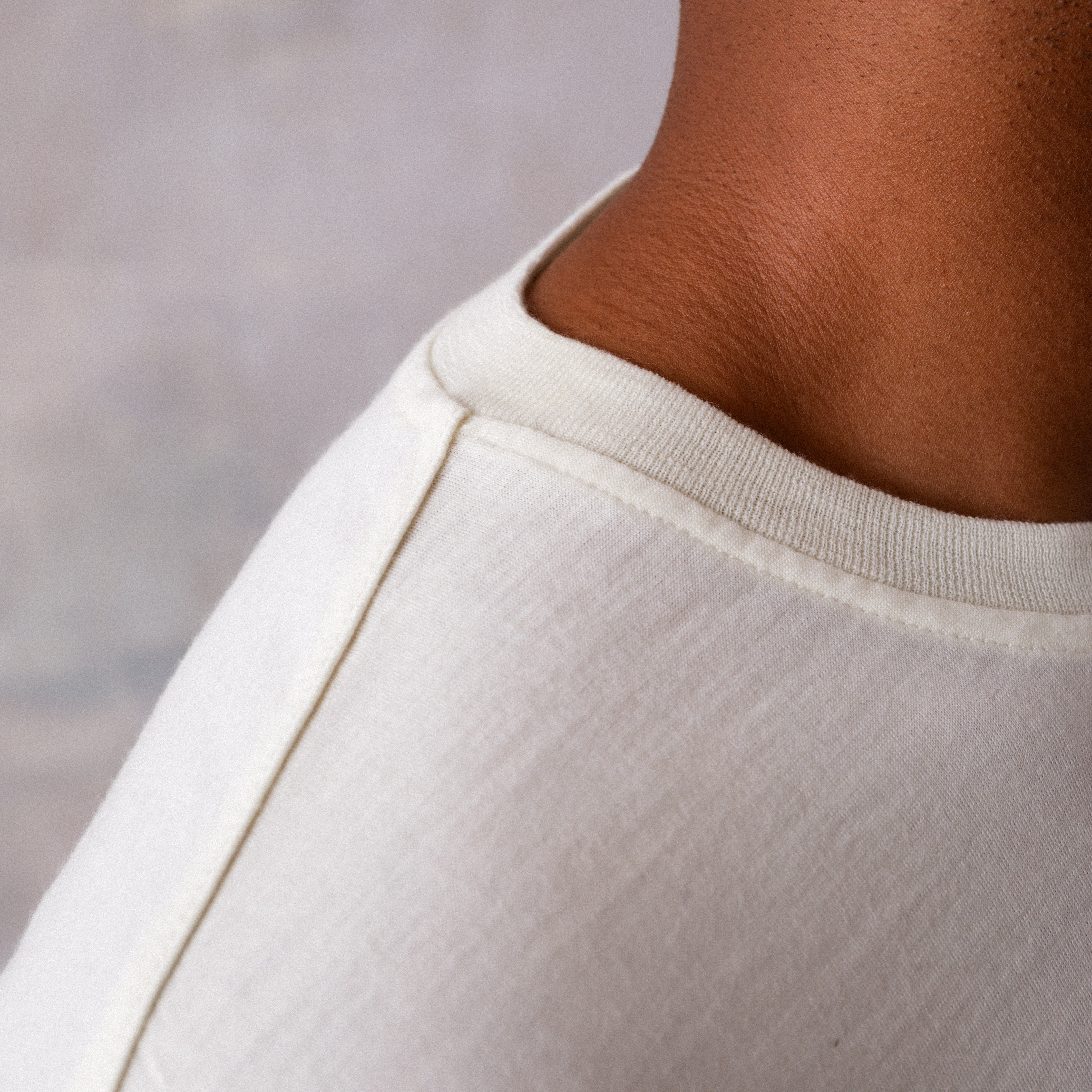 The Regular T-Shirt in undyed natural extrafine merino wool, arm detail view