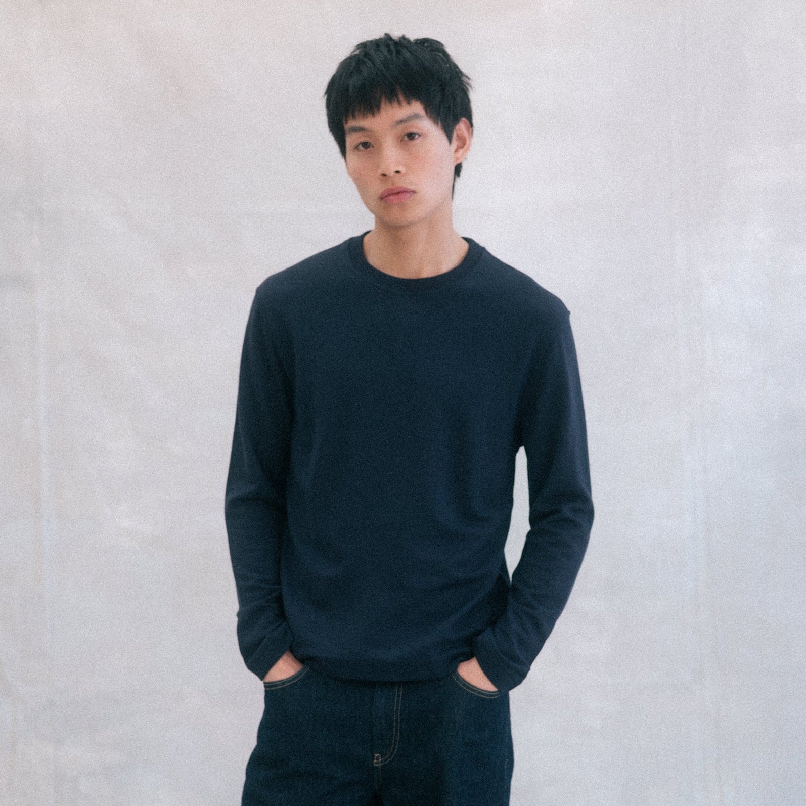 The Lightweight Sweatshirt in blue heavy merino wool, model wearing front view