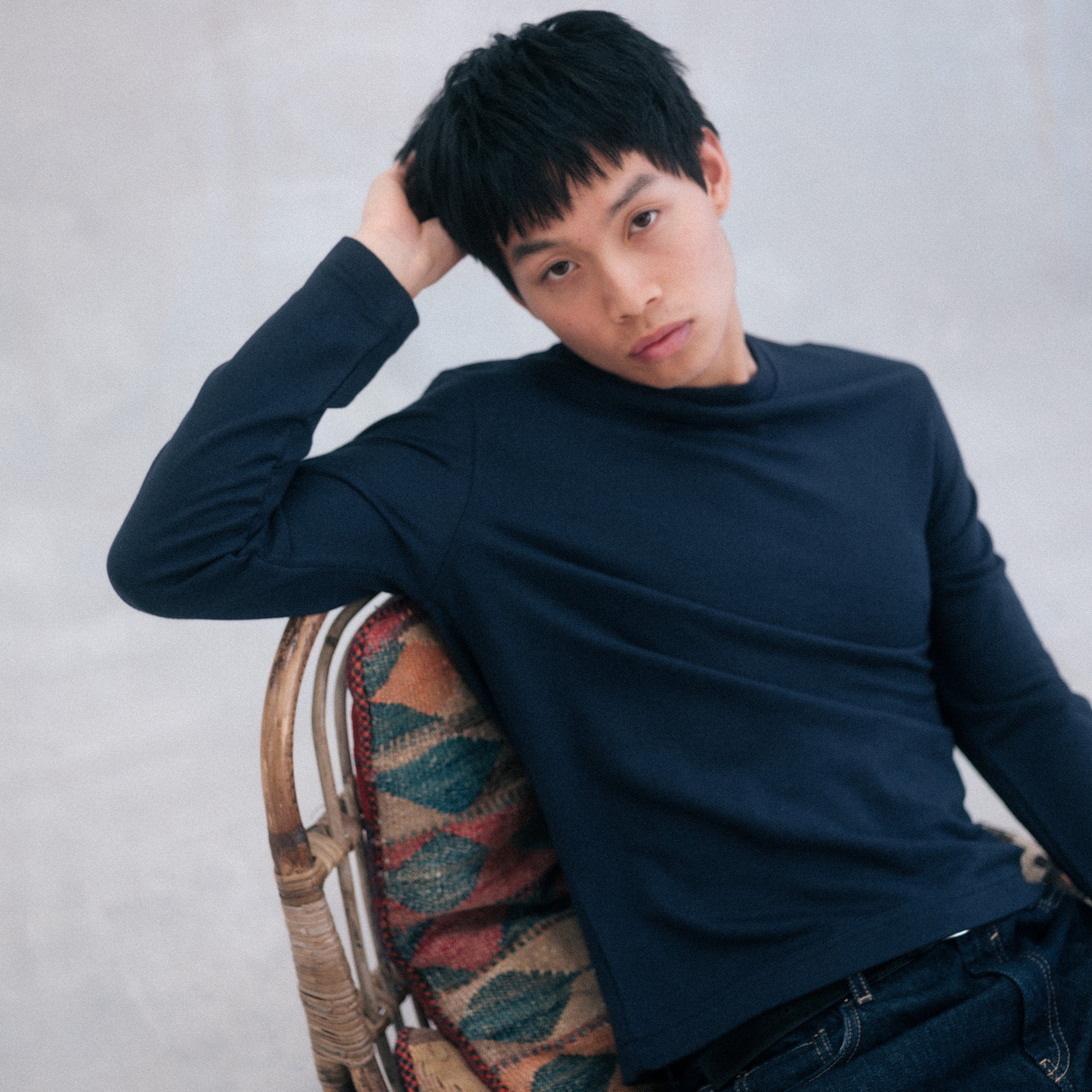 The Lightweight Sweatshirt in blue heavy merino wool, model wearing back view